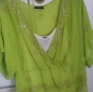 Plus size figure flattering green beaded peplum tunic top with cream camisole